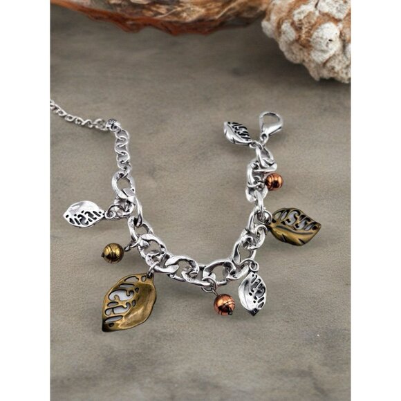 Bright Leaf Song Charm Bracelet Mixed Metals Leaves Pouch. - Picture 1 of 4